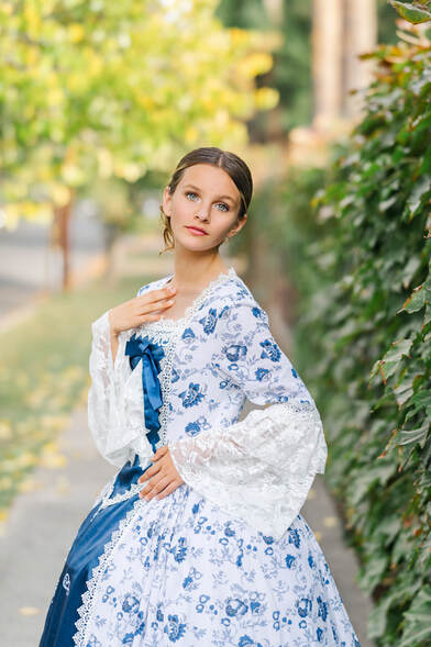 teenager in southern bell blue and white dress