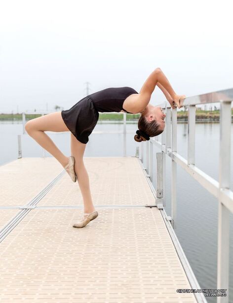 ballet girl oin black leotard bending back