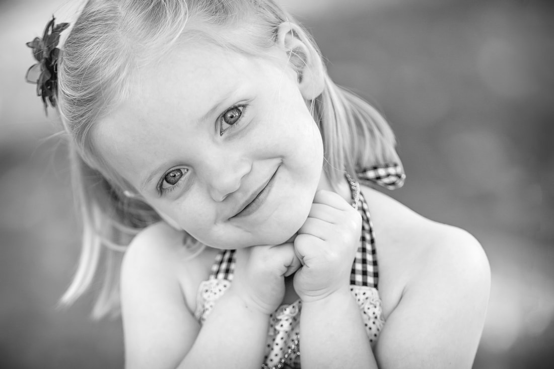 black and white of young girl smiling