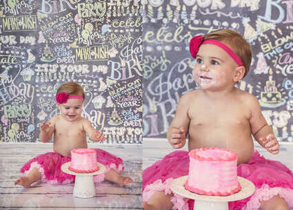baby sitting up touching a 1st birthday cake