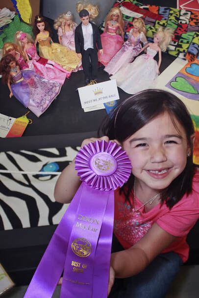 young girl with purple ribbon
