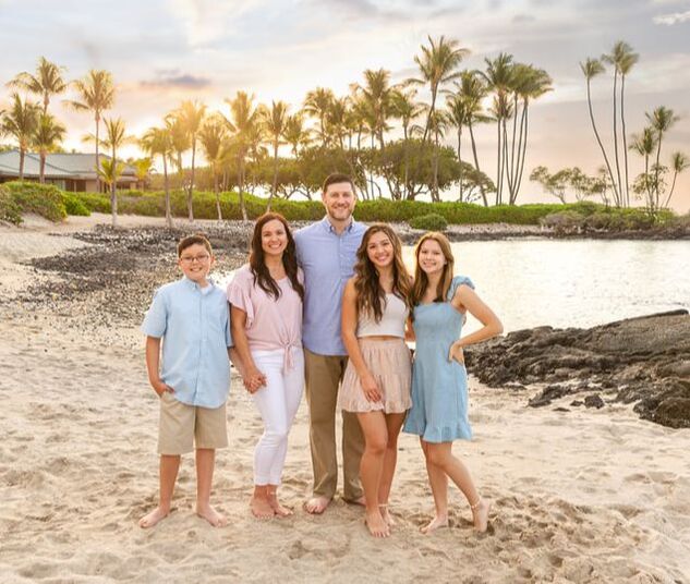 Christine's family photo of five in Hawaii on the beach