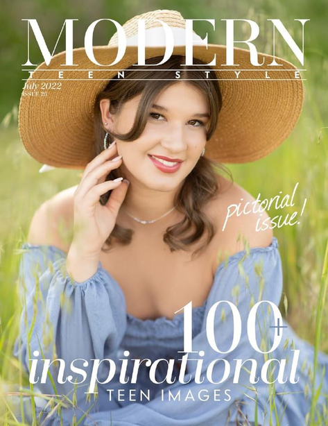 magazine cover with girl in hat and blue dress sitting in grass