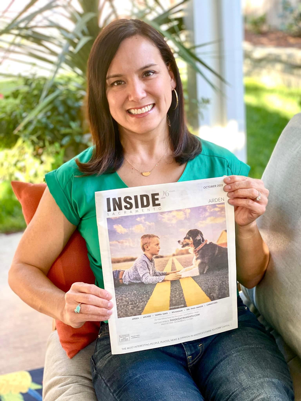 Christine Higgs holding Inside Sacramento magazine