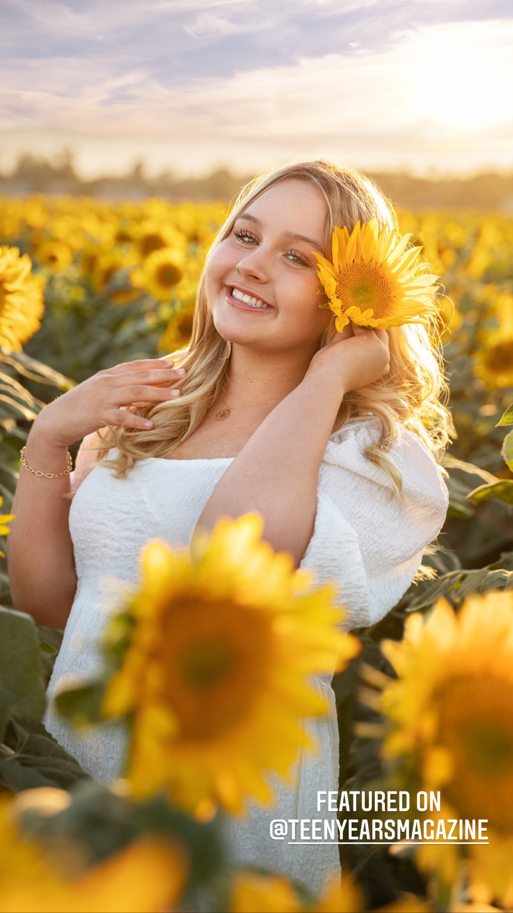 teenage blond girl in sunflower field at sunset