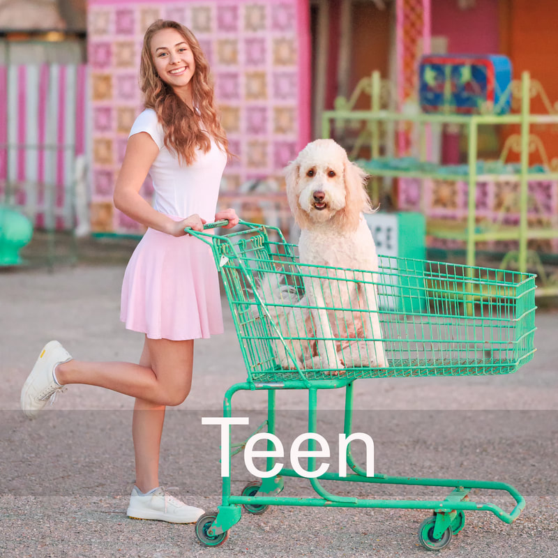 teen girl in skirt pushing shopping cart with dog inside